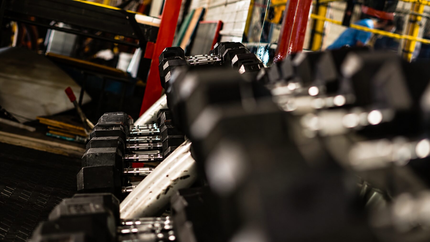 Close-up of the dumbbell rack on the free weight floor at Sud'n Impact in Fort Wayne